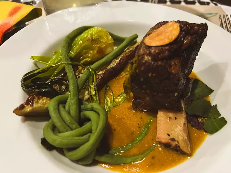 Image: This bone-on short rib with a peanut sauce from Chef Randall Braud was one of our favorite bites at the first Mad Hatter pop-up supporting Independence Gardens.