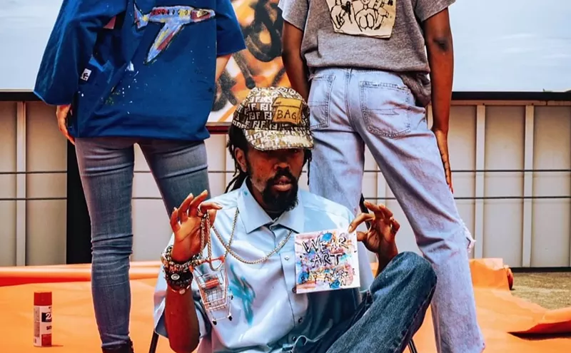 Image: Mallo the Great Sells Amerikon Clothing From a Shopping Cart on the Streets of Deep Ellum
