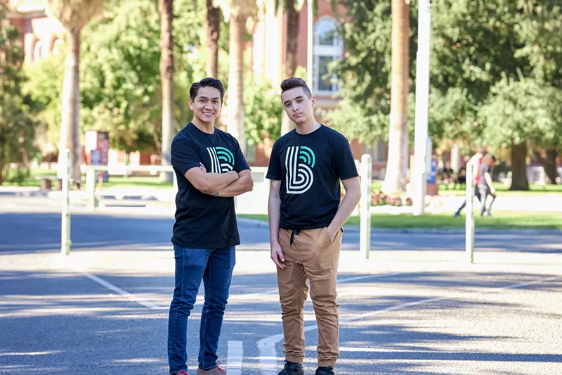 Image: "Big" Gustavo and Marco, the "little" he mentors though Big Brothers and Big Sisters, which needs more men to volunteer.