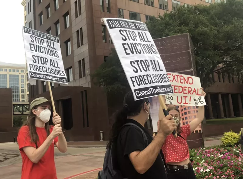 Image: In September 2020, North Texans gathered outside U.S. Sen. John Cornyn's office building waving signs that read "Stop All Evictions" and "Let Us Live."