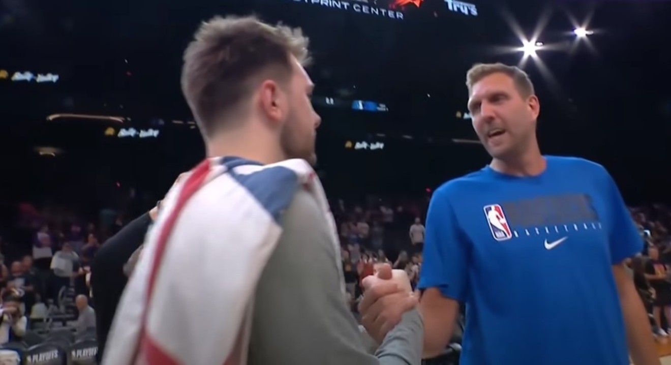 Luka Dončić (left) and Dirk Nowitzki (right) exchange a few words and a hug after the Mavericks' shocker win on Sunday against the top-rated Phoenix Suns in Game 7 of the NBA's Western Conference Semifinals in Phoenix.