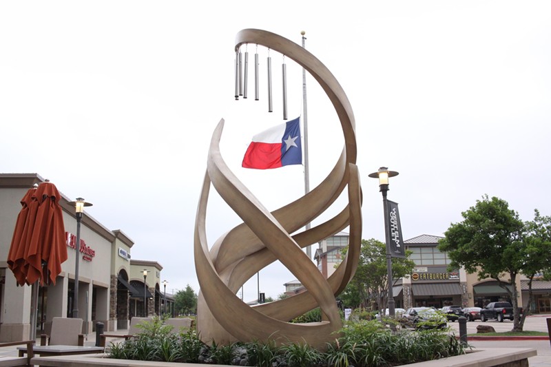 The permanent memorial for the Allen shooting victims features eight wind chimes.