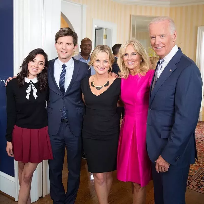 Image: The Parks and Rec cast (from left: Aubrey Plaza, Adam Scott and Amy Pohler) with First Lady Jill Biden and President Joe Biden (fourth and fifth from left).