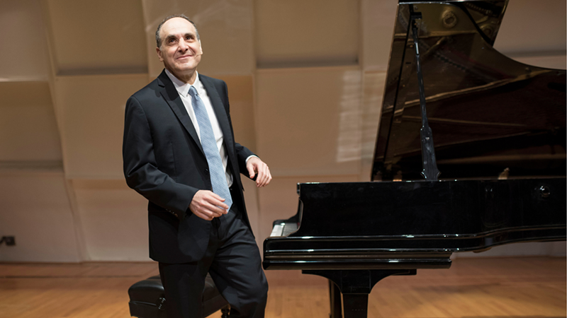Image: Dallas Symphony Orchestra's Dr. Richard Rogan near a piano.