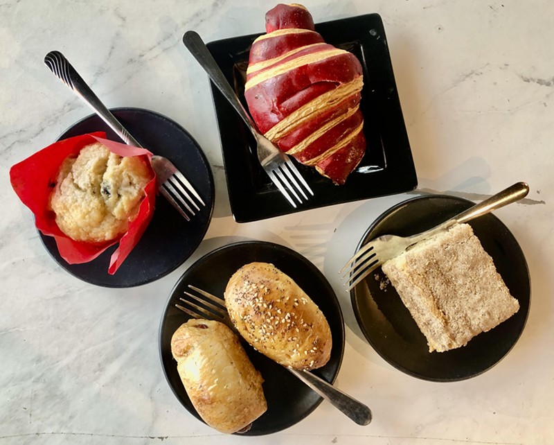 A blueberry muffin, raspberry croissant, gluten-free coffee cake and a pair of kolaches. The gluten-free desserts here are divine.