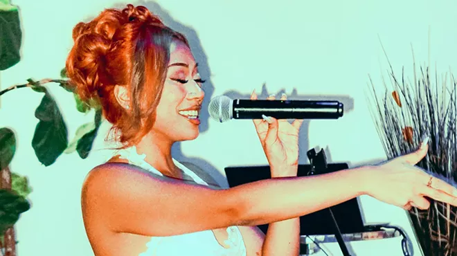 Woman singing on stage