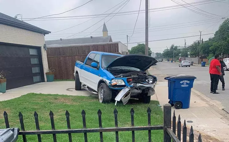 Image: crashed truck in front yard