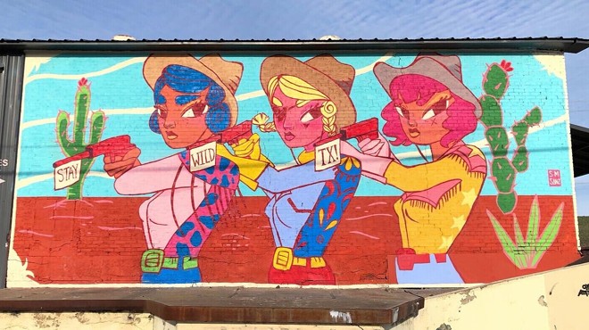 Three vibrantly painted cowgirls make up the Stay Wild Mural in West Dallas.
