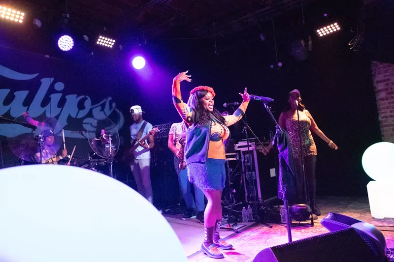 Image: A group performing on stage