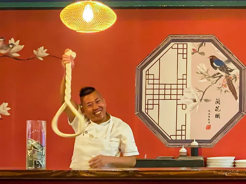 Image: At Taste of Peking, Mr. Charlie is living his best hand-pulled noodle life.