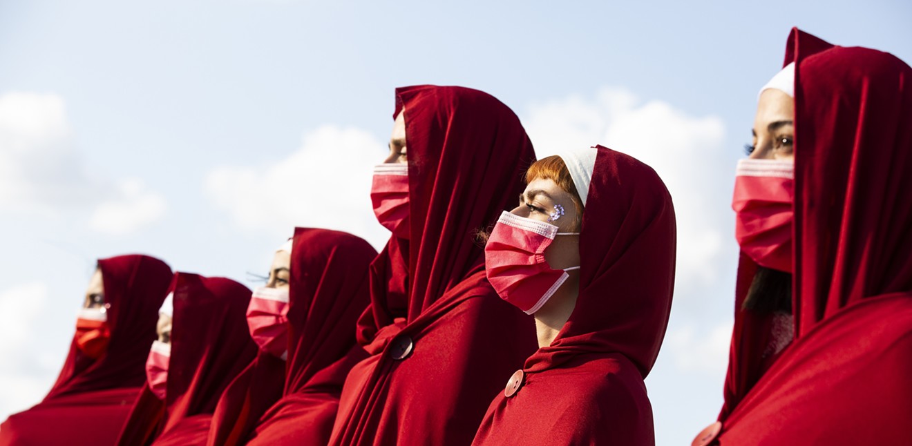 Twitter users are comparing Texas to the dystopian land of Gilead from The Handmaid's Tale and to the Taliban following Gov. Greg Abbott's signing if restrictive abortion laws.