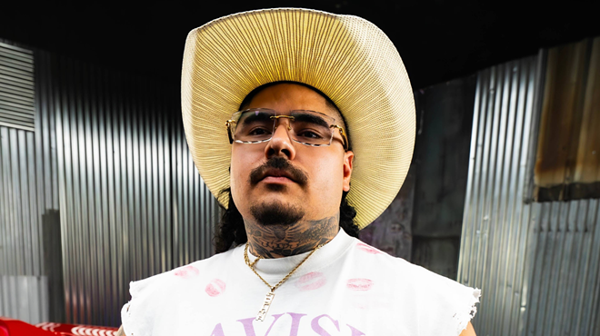 Man with a cowboy hat and glasses