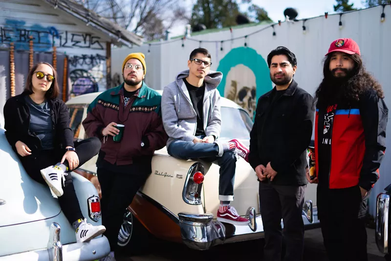Image: Band posing for a picture