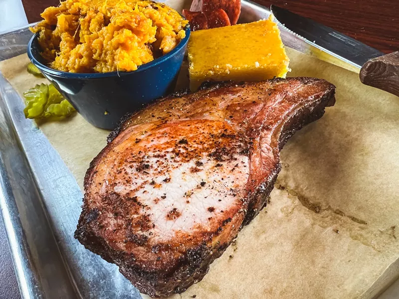 Image: Slow Bone's smoked pork chop will cure what ails you, as long as you're ailing on Sunday or Monday.