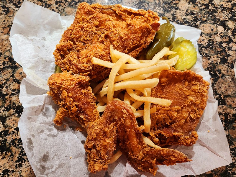 Hall's four-piece mixed basket with white bread, fries, pickles and jalapeno.