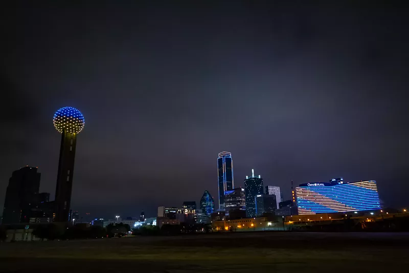 Image: Dallas's skyline turned blue and yellow in solidarity with Ukraine after news broke that it was invaded by Russian forces on Thursday.