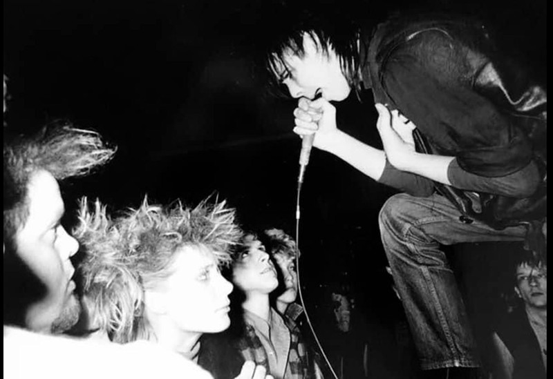 The Birthday Party at Hot Klub on April 2, 1983. Nick Cave (second from right) sings as David Yow (far right corner) watches the show.