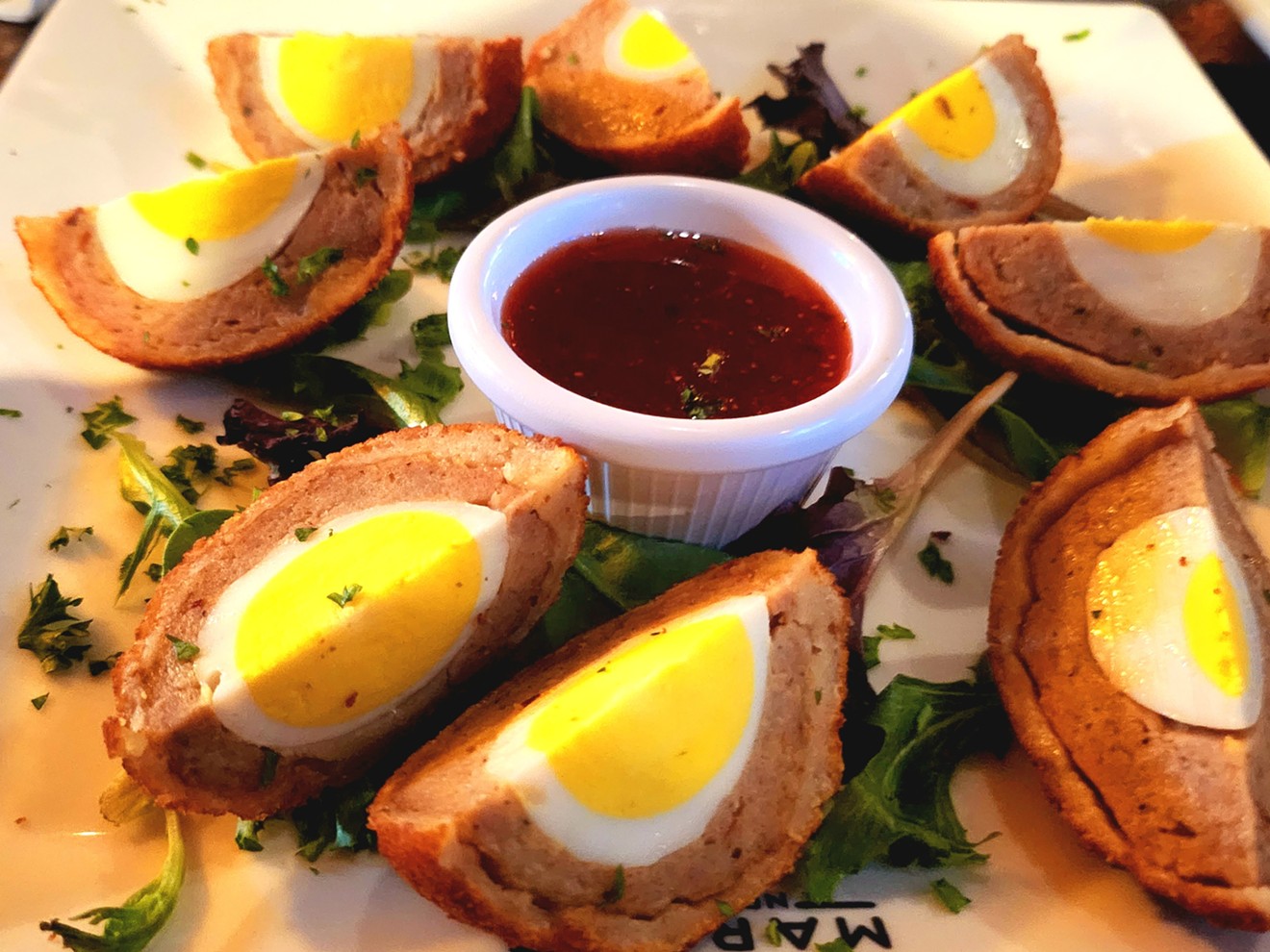 The Londoner's Scotch eggs come paired with strawberry-jalapeño jam.