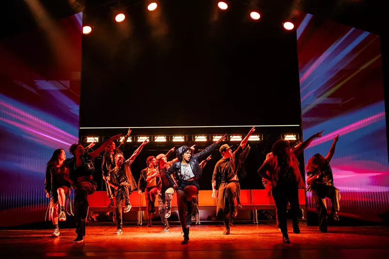 Image: Frankie Healy dancing with the Jagged Little Pill ensemble in the jukebox musical based on the classic alt-rock Alanis album.