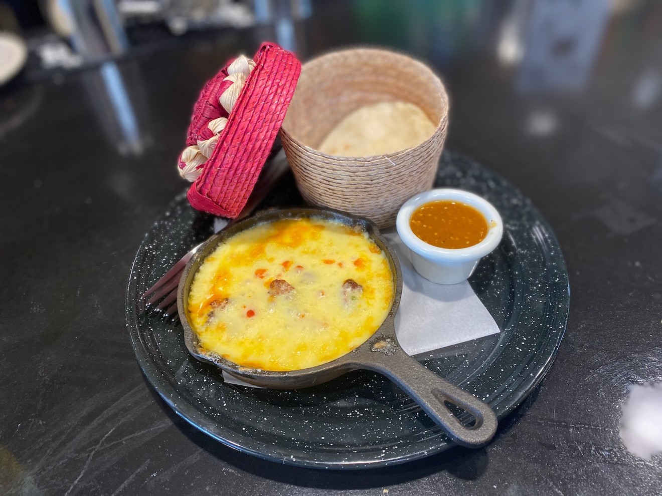 Queso fundido is literally a job requirement.