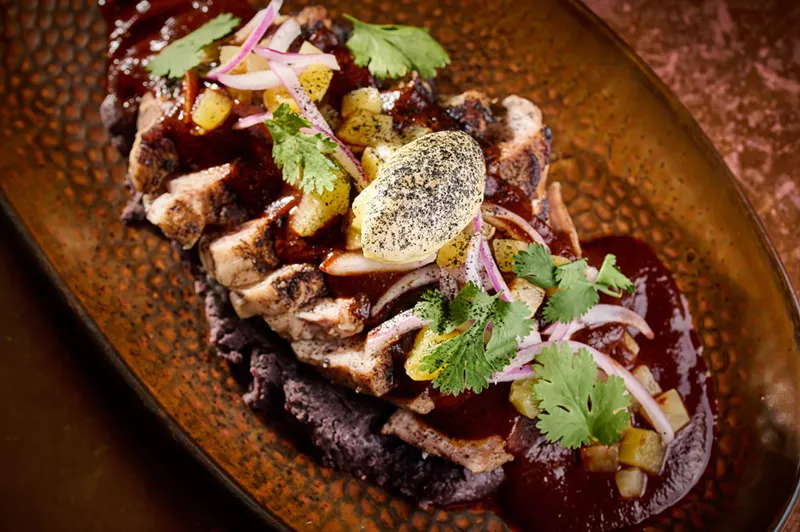 Image: Al pastor at El Carlos Elegante is cooked over a wood-fired grill and served with an abodo sauce.