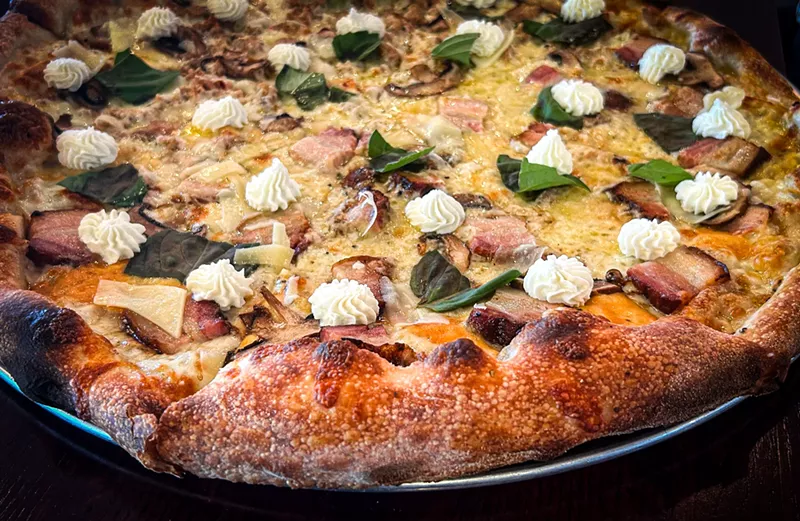 Image: The Holy Cheesus topped with happy dollops of mozzarella.