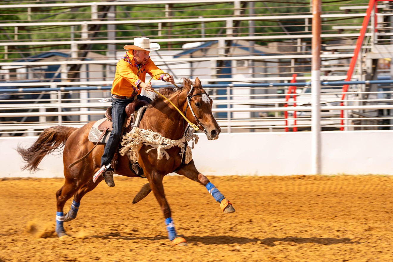 A contestant races toward the barrels in the barrel race competition at the 41st Texas Tradition Rodeo.