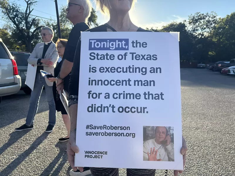 Image: A protestor holds a sign in Huntsville on Oct. 17, when Robert Roberson was scheduled to be executed.