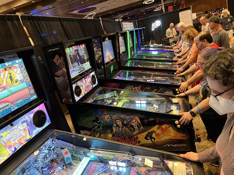 Image: Guests of the Texas Pinball Festival at the Frisco Convention Center test drive some new games from Multimorphic Pinball.