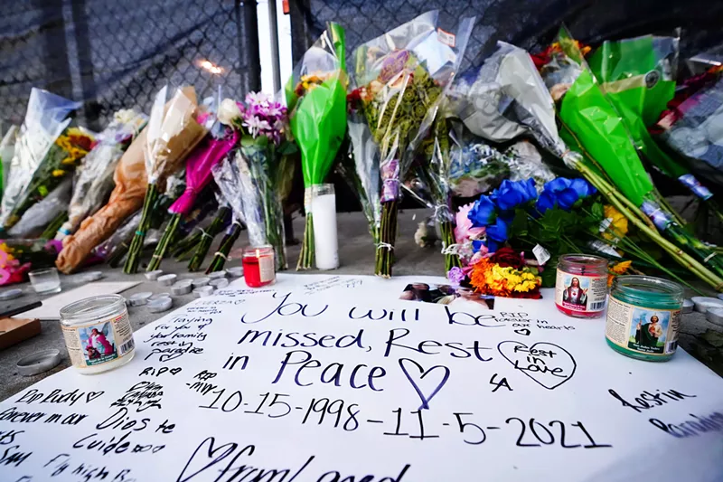 Image: A makeshift memorial outside Houston's NRG Park, where Travis Scott's Astroworld festival resulted in 10 deaths and hundreds of injuries.