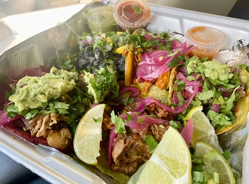 Image: A plate of colorful tacos from El Rincon del Maiz.
