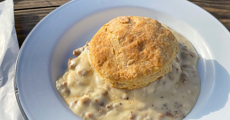 A biscuit with gravy at Bonton Market - TAYLOR ADAMS