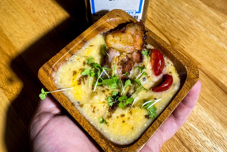 Smoke and Biscuits' smoked pork belly with cheddar grits topped with microgreens. - SEAN WELCH