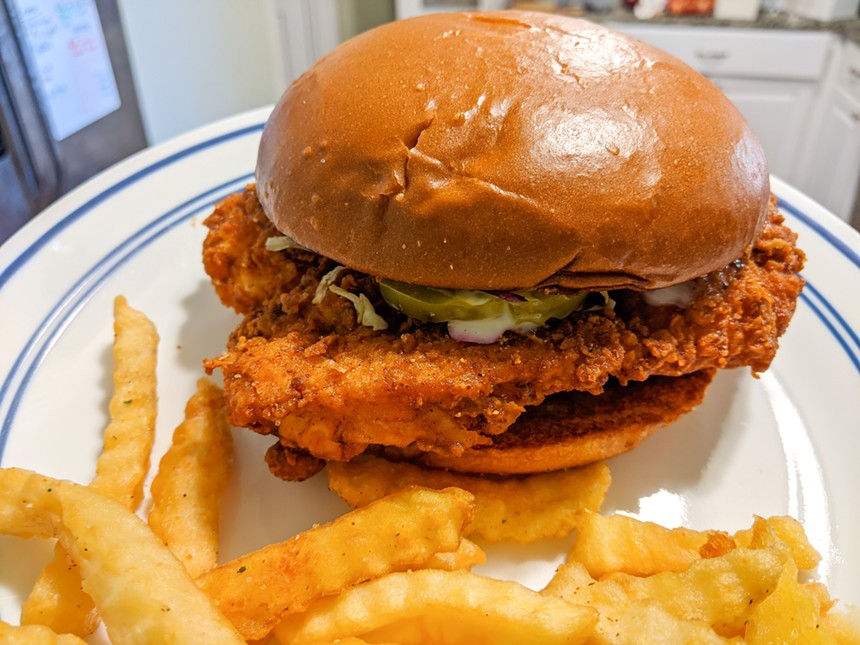 A takeout chicken sandwich, plated at home, from 2 Neighbors, in DeSoto - BRIAN REINHART