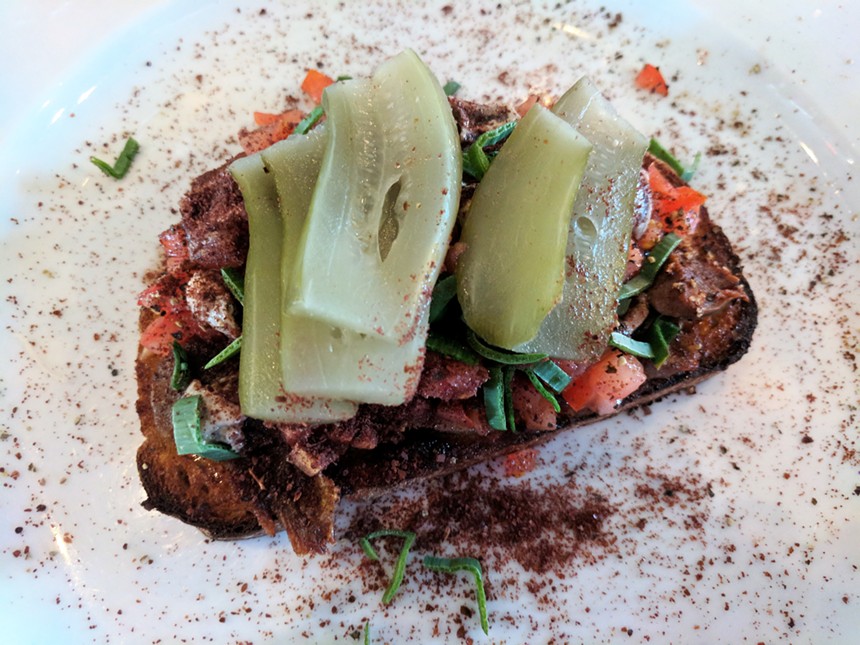 Lamb tongue crostini with Israeli-style pickles at Canary by Gorji. - BRIAN REINHART