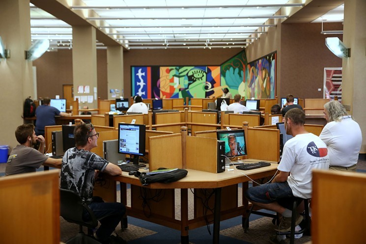 Computer stations at Dallas' central library, which is open again. - DYLAN HOLLINGSWORTH