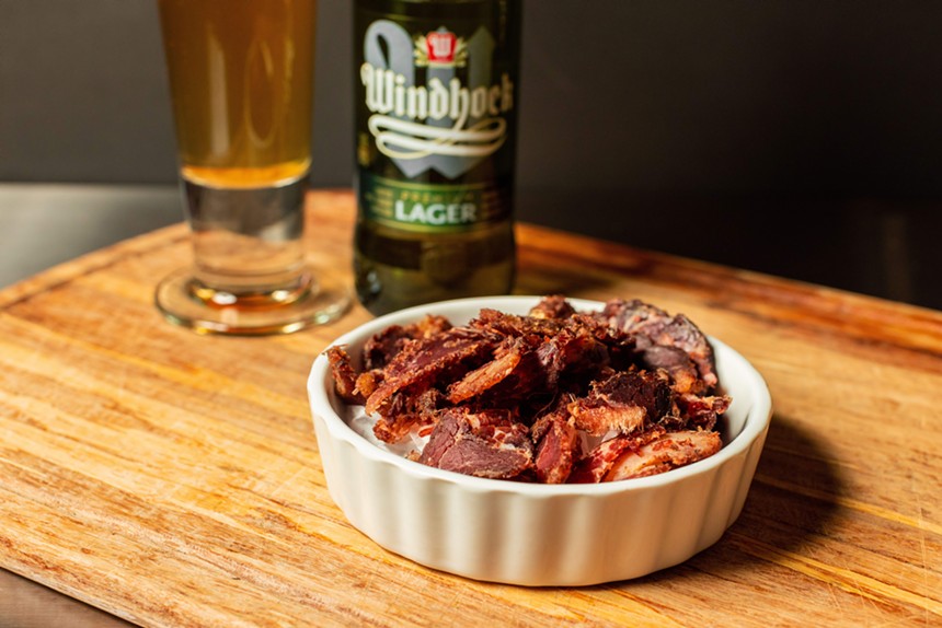 Biltong is South African-style beef jerky with Windhoeck beer from Namibia. - COURTESY OF WITS STEAKHOUSE, PHOTO BY KATHY TRAN