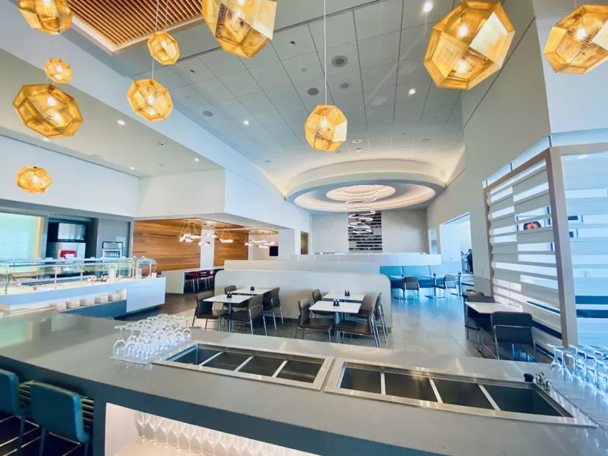 The self-serve area in the lounge has some tables and is surrounded by more casual seating. - LAUREN DREWES DANIELS