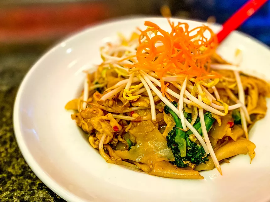 Pad see lew bringsrice noodles, egg, gai lan, broccoli and bok choi with bean sprouts in a brown sauce. - HANK VAUGHN