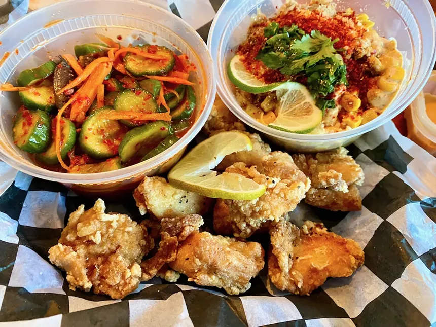 On the top left is the cucumber salad with one little crab claw sticking out; more is buried within the salad. - LAUREN DREWES DANIELS