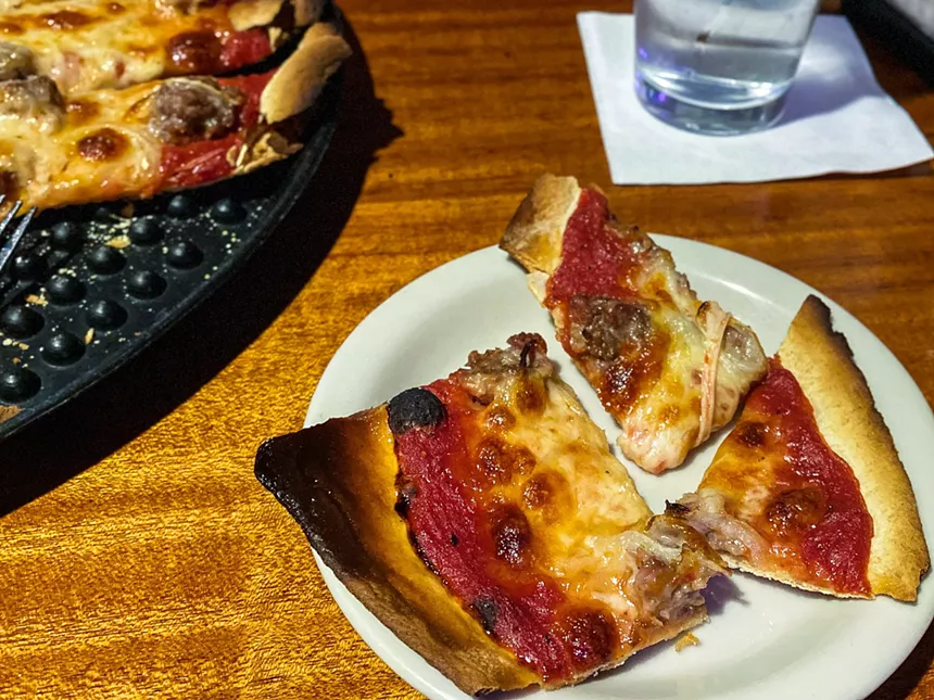 thin slices, including the coveted corner piece - HANK VAUGHN
