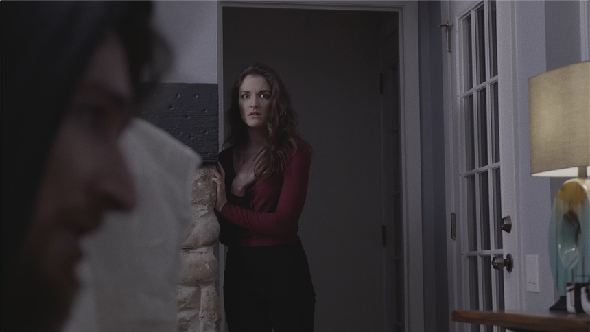 Agatha, played by Bridie Marie Corbett, listens to a terrifying tale from The Tall Figure, played by Spencer McAfee, in the locally produced horror film 13 Tracks to Frighten Agatha Black. - LAMPKIN LANE PRODUCTIONS