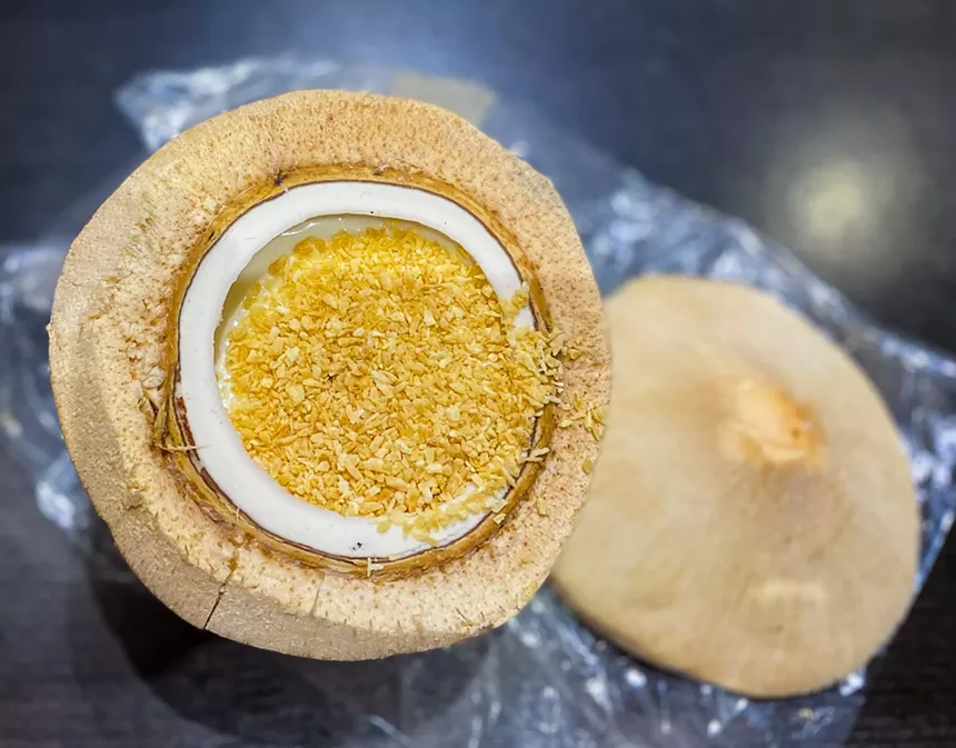 The whole coconut jelly trio comes inside a coconut with coconut pudding, coconut meat, and toasted coconut flakes. - HANK VAUGHN