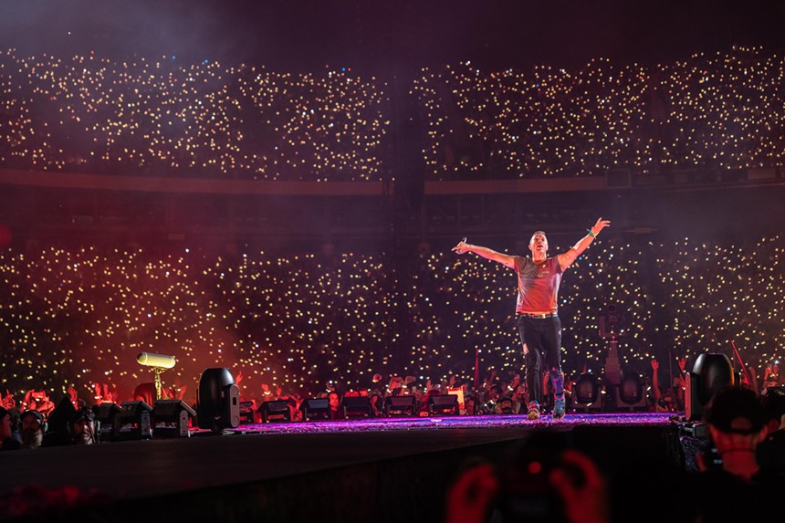 Chris Martin asked fans to put down their phones and share the moment.  -ANDREW SHERMAN