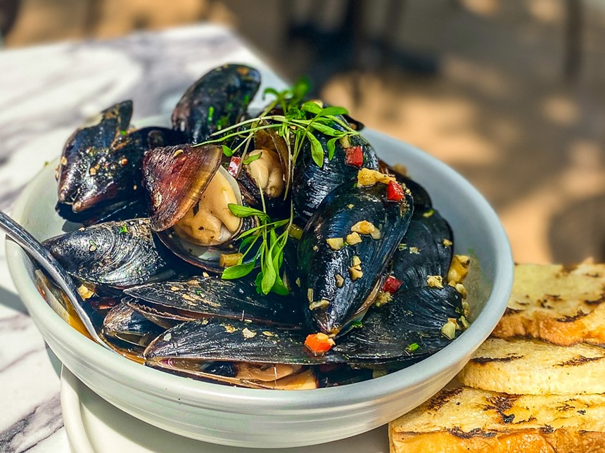 Spicy Thai-style mussels with grilled bread to sop a rich broth. - HANK VAUGHN