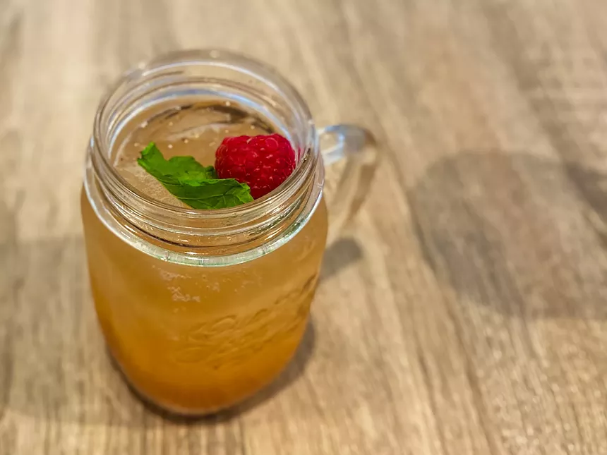 Brunch Punch: Skyy Vodka, Champagne, Pineapple Juice, Freshly Squeezed Orange Juice, Sprite Signature Fruit Puree and Honeyberry - HANK VAUGHN
