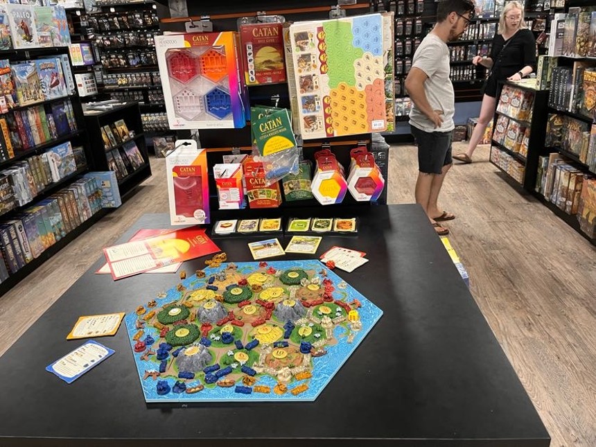 Common Ground Games co-owner DR Hanson says they've installed game demo areas in his store so players can test games before they buy them, like this topographic version of the popular territory gaining strategy game Settlers of Catan. - DANNY GALLAGHER