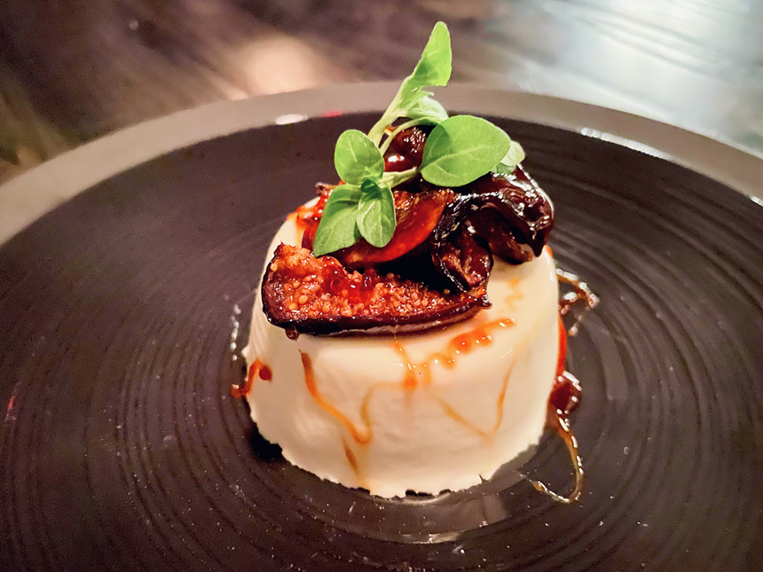 A buttermilk and goat cheese panna cotta topped with figs and honey at The Saint