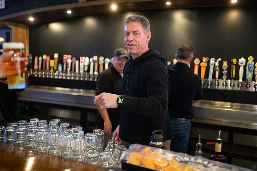 Troy Aikman tending bar at The Katy Trail Ice House