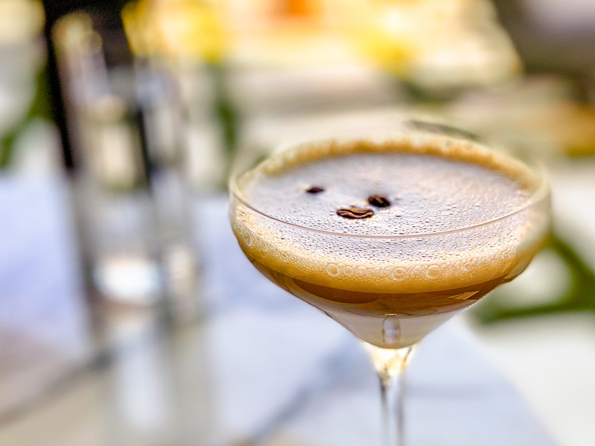 A glass holds an espresso martini at Catbird, one of the best Dallas spots for a Valentine's Day date.